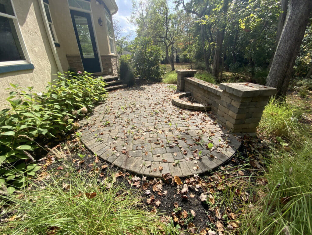 Paver patio in Gahanna OH that needs repairs and restoration.