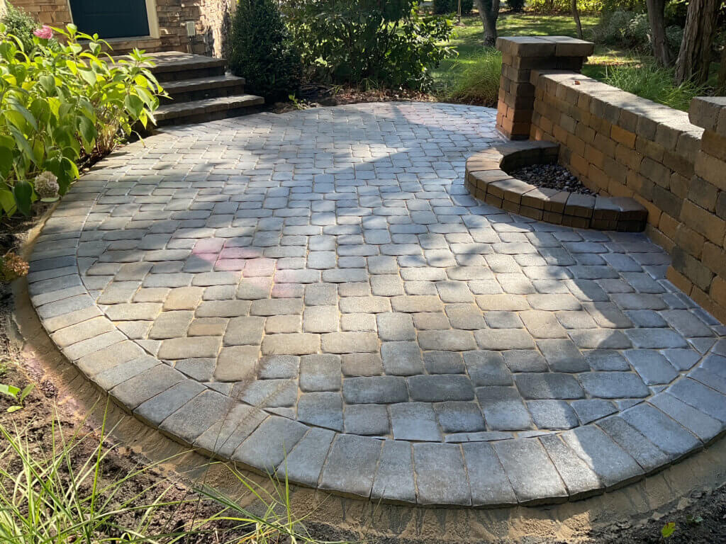 After photo of sealed and restored paver patio with PermaEdge installation by Perfect Paver Co.