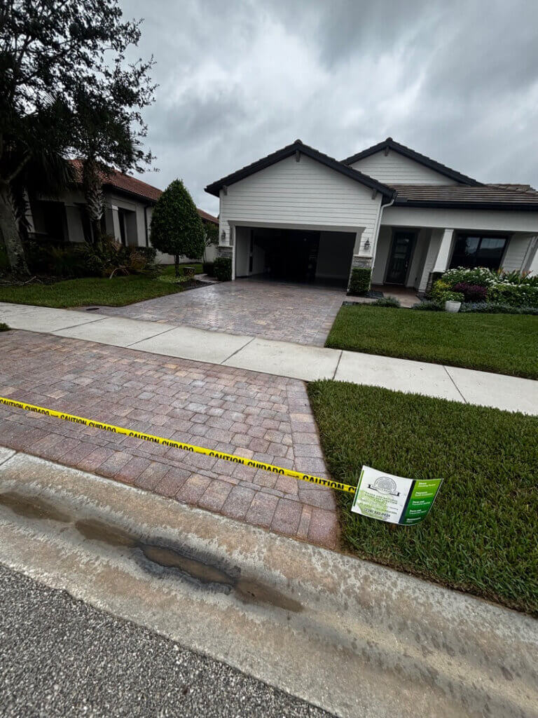 After picture of paver driveway in Greyhawk Naples FL that Perfect Paver Co repaired and sealed