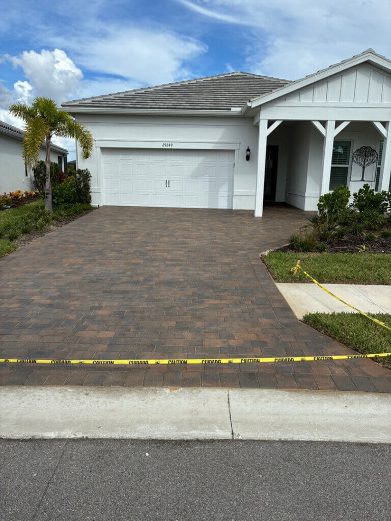 Paver driveway sealing in Coral Harbour community in Englewood FL right after Perfect Paver Co sealed it