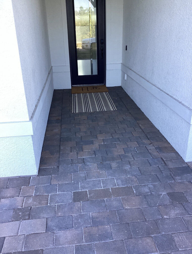 Before pictures of a paver entrance in Englewood Fl before Perfect Paver Co cleaned and sealed it